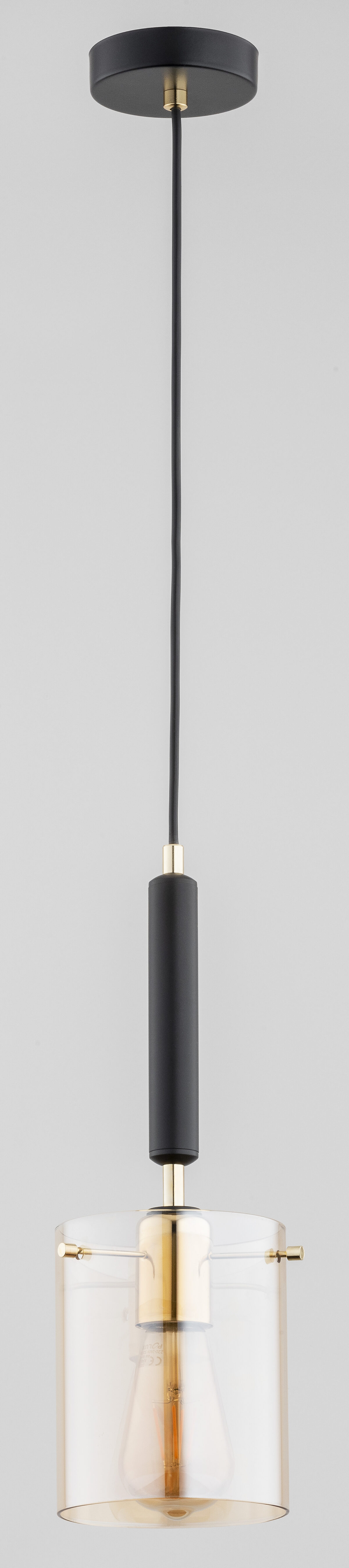 Lampa wisząca 1 punktowa ze szklanym kloszem. Elementy metalowe wykończone w kolorze czarnym.